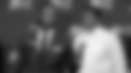 Cardinals wide receiver Larry Fitzgerald answers during a press conference Monday at the NFL owners meetings held at the Arizona Biltmore with Tyrese Cullet, a high school student from Florida, listening in.