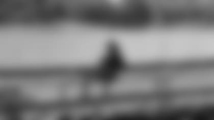 Wide receiver Larry Fitzgerald sits on the dock behind his house in Minnesota.