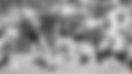 Punter Andy Lee launches a kick against the Raiders last week.