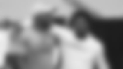 Running back David Johnson and cornerback Brandon Williams pal around heading into Friday's conditioning test at University of Phoenix Stadium.