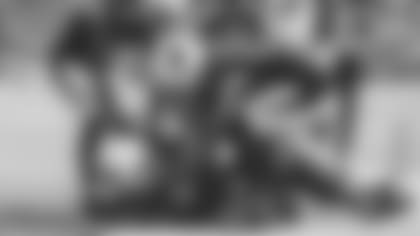 Wide receiver DeAndre Hopkins is congratulated by teammates James Conner (right) and Christian Kirk after his game-winning touchdown Sunday against the 49ers.