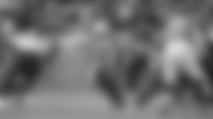 Cardinals quarterback Trace McSorley tries to escape the Broncos' pass rush during the game in Denver Sunday.