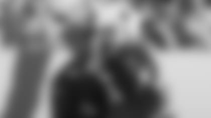 Defensive coordinator Vance Joseph (left) will disguise his calls more with linebacker Jordan Hicks if there are no crowds this season.