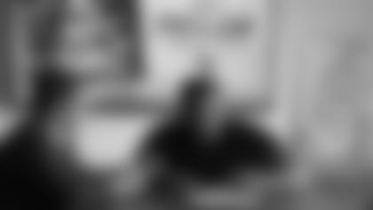 New Cardinals defensive lineman Darius Philon signs his contract Thursday alongside director of football administration Matt Harriss.