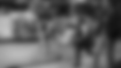 Linebacker Dennis Gardeck gets out a new bike for a couple of excited children during Tuesday night's "Shop with a Jock" event.