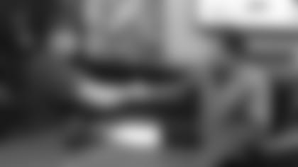 Third-round pick Mason Cole shakes hands with team president Michael Bidwill after signing his contract.