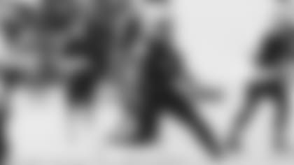 Running back Tavien Feaster runs the ball at a recent practice.