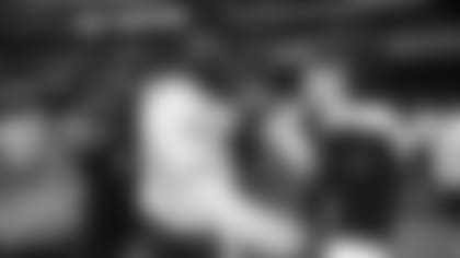 Cardinals quarterback Kyler Murray talks to Hector Nahle, a young cancer survivor whom Murray befriended over social media, before Monday's game in Mexico City.