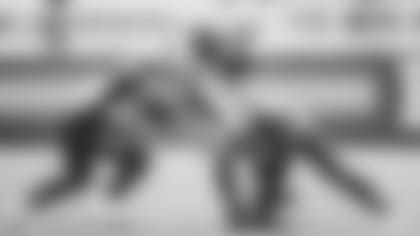 LB Jordan Hicks (left) and S Chris Banjo combine to tackle 49ers tight end George Kittle in last week's win.