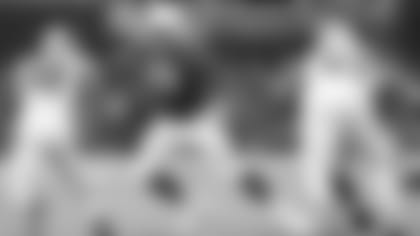 Tackle Jordan Mills moves to make a block against Panthers in 2019