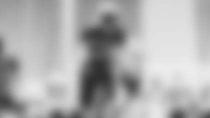 RB Eno Benjamin carries the ball during training camp.