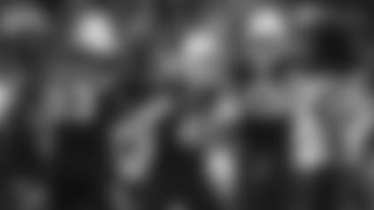 Jonathan Ledbetter (93), Dennis Gardeck (45) and Ezekiel Turner (47) celebrate a play last week against the Buccaneers.