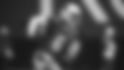 Running back James Conner runs upfield during the Cardinals' first practice of training camp on Wednesday.