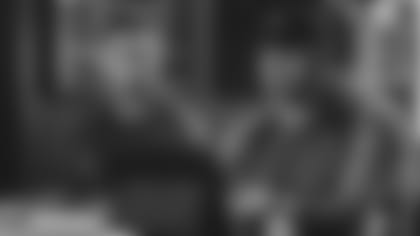 Coach Kliff Kingsbury and GM Steve Keim, here in their suite watching workouts in 2019 in Indianapolis, return for the Scouting combine after a year cancelled by Covid.