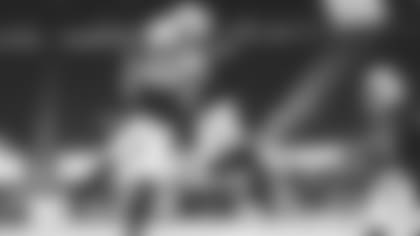 Linebacker Isaiah Simmons (48) celebrates with cornerback Byron Murphy as linebacker Haason Reddick (43) looks on after Simmons' overtime interception against the Seahawks last weekend.