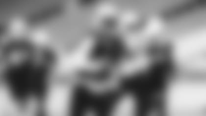 QB Kyler Murray carries the ball in training camp.