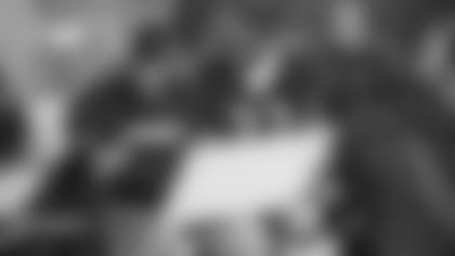 Steve Wilks, then the defensive backs coach with the Bears, speaks with CB Charles Tillman on the sideline during a game.