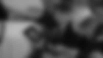 Cardinals president Michael Bidwill looks at the program during the funeral of his father, Bill Bidwill, on Tuesday.