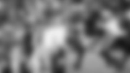 On left, Brown skies on the play in which he injured his foot in 2022; on right, he scores a touchdown against the Eagles.