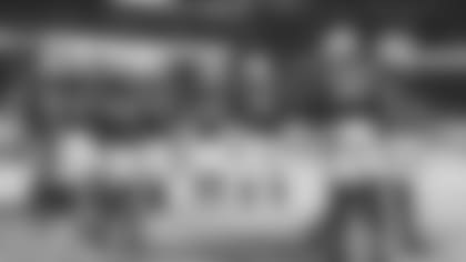 S Budda Baker (32) collects imaginary ballots from his teammates after his interception on Sunday.