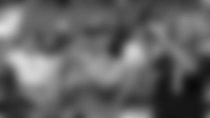 Fans take photos during the 2021 Back Together Saturday practice at State Farm Stadium.