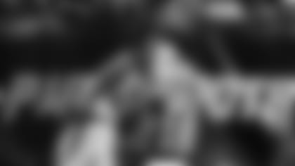 Cornerback Bene Benwikere makes an interception Friday night in New Orleans.