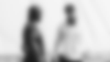 Coach Kliff Kingsbury (right) and quarterback Kyler Murray talk at a recent practice.