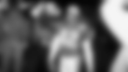 Safety Kwamie Lassiter smiles after the Cardinals won a playoff game in Dallas, 20-7, in January 1999.