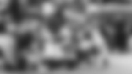 Defensive lineman Michael Dogbe and linebacker Devon Kennard combine for a run stop last week in Detroit.