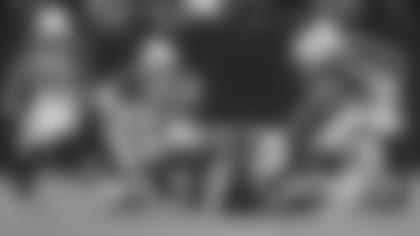 Cornerback Byron Murphy Jr. scoops up the fumble that he returned for a touchdown in Sunday's 29-23 overtime win in Las Vegas.