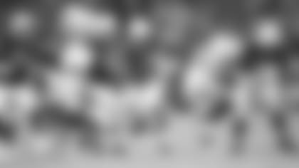 Running back David Johnson runs through the line during the Cardinals' preseason game against the Chargers last month.