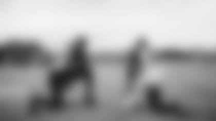 Linebacker Chandler Jones and safety Budda Baker chat during some downtime at a practice this week.