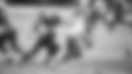 Defensive lineman Josh Mauro chases down Bills quarterback Josh Allen during a game last season.