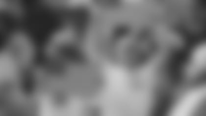 A fan holds an American flag honoring the 9/11 tragedy during a Cardinals' home game against the Falcons on Sept. 30, 2001 at Sun Devil Stadium.