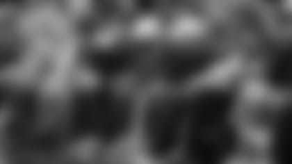 Cardinals quarterback Kyler Murray (in purple sweater) watches the Suns take on the Lakers on Tuesday.