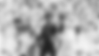 Quarterback Kyler Murray, sitting out Sunday's game against the 49ers, congratulates guard Max Garcia -- before Garcia re-injured himself -- during the Cardinals' 31-17 win in San Francisco.