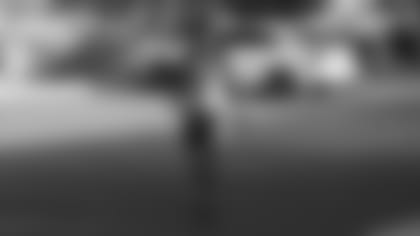 RB Chase Edmonds heads into the Cardinals' training facility on Thursday.