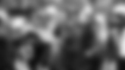 Cardinals coach Kliff Kingsbury consults his play sheet during a game in 2019.