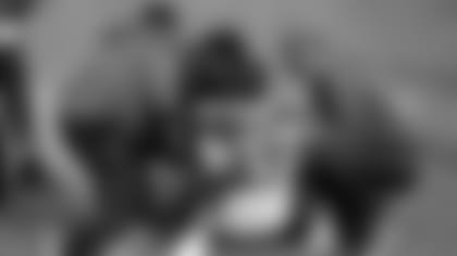 Guard Justin Pugh is tended to by the Cardinals' medical staff after hurting his left knee Sunday in Kansas City.