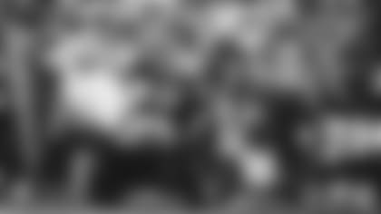 Tight end Maxx Williams (87) gets encouragement from quarterback Kyler Murray before being carted off the field after a knee injury in Week 5 of the 2021 season.