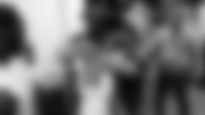 Then-coach Bruce Arians hugs wide receiver Larry Fitzgerald in the visitors' locker room in Seattle following what turned out to be Arians' final game with the Cardinals before announcing his retirement.