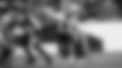 Quarterback Colt McCoy scrambles during the Cardinals' 24-15 loss in Denver on Sunday.