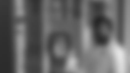 Cardinals rookie linebacker Airius Moore in front of Pat Tillman's locker, which is a permanent part of the team's Tempe facility.