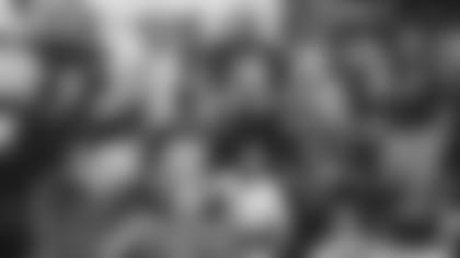 Quarterback Kyler Murray poses for a group photo with teachers from around the Valley during a community appearance Thursday.