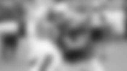 Center A.Q. Shipley (53) battles defensive tackle Corey Peters at the outset of practice Saturday. Shipley later was carted to the locker room with an apparent knee injury.