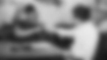 Sixth-round pick Keontay Ingram fistbumps owner Michael Bidwill after signing his first NFL contract Thursday.