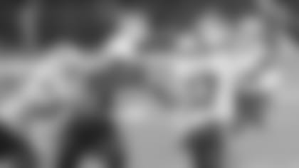 Defensive lineman Corey Peters (98) closes in on Bills quarterback Josh Allen during Sunday's game. Peters later suffered a season-ending knee injury.