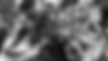 Brentson Buckner, who has returned to his former job as Cardinals' defensive line coach, works with the Cards' defensive line in 2017.