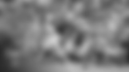 Tight end Maxx Williams (87) brings down a catch against linebacker Isaiah Simmons (9) during the 2021 Red-White Practice at training camp.