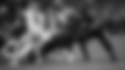 Running back Eno Benjamin plunges in for an upside-down touchdown against the Saints last week.